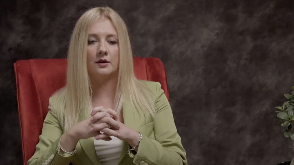 Person at petrol station cleaning windscreen window with surprise look