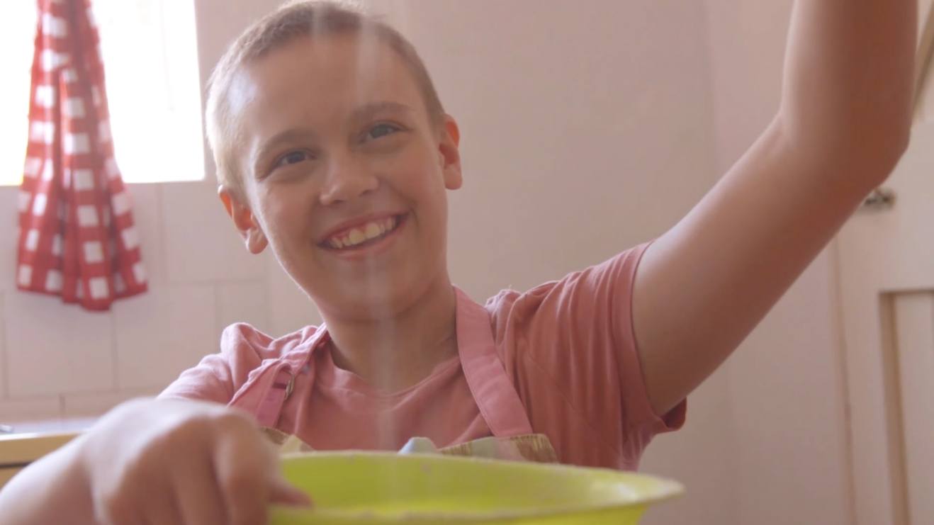 Little girl baking in a kitchen