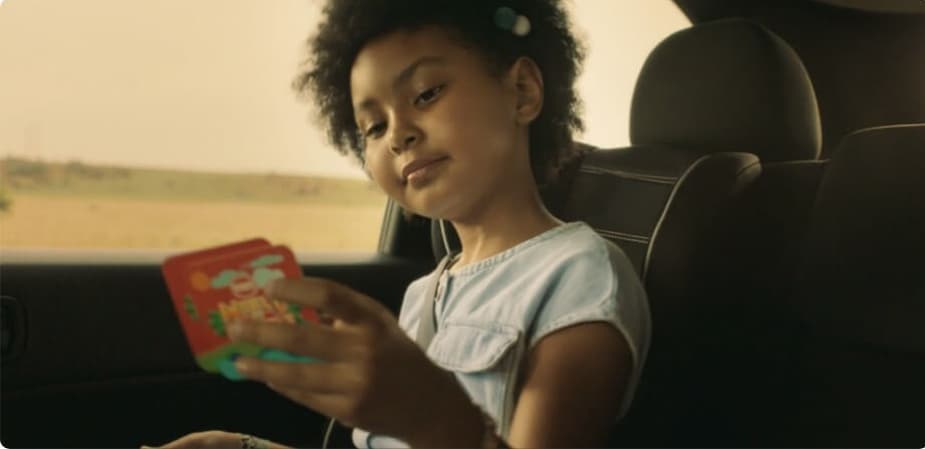 little girl looking at animal ar cards
