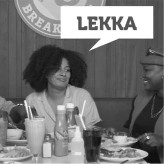 People sitting at a Wimpy table saying lekka